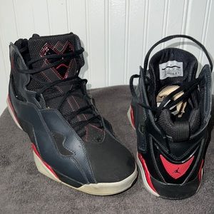 A pair of Jordan true flight retro bred sneakers for men size 11